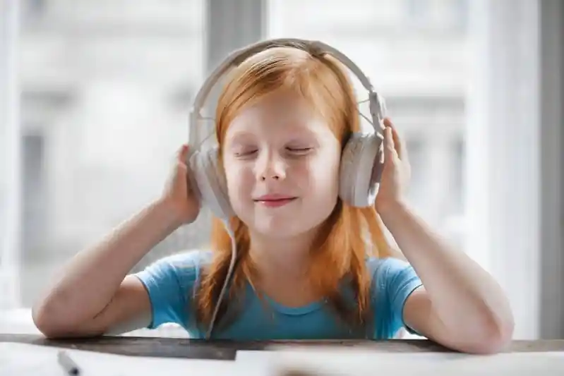 Girl with headphones to make her feel Safe and Sound